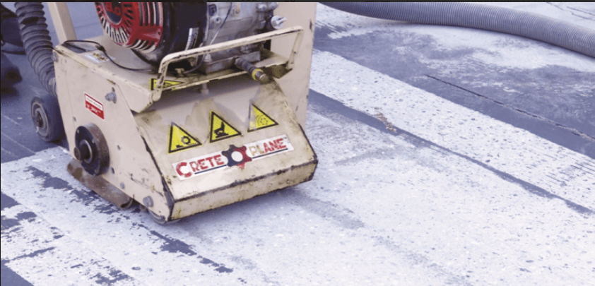 EDCO concrete scarifier leveling a concrete floor
